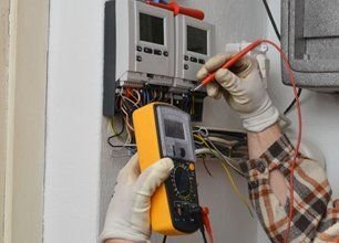 Hold a volt meter checking panel box